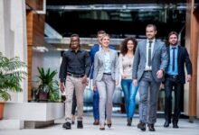 Group of a young business people discussing business plan.